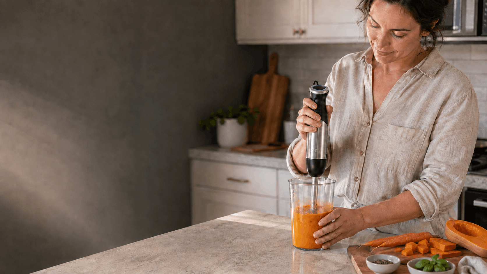 Making fresh food with a KOIOS hand blender in a bright kitchen